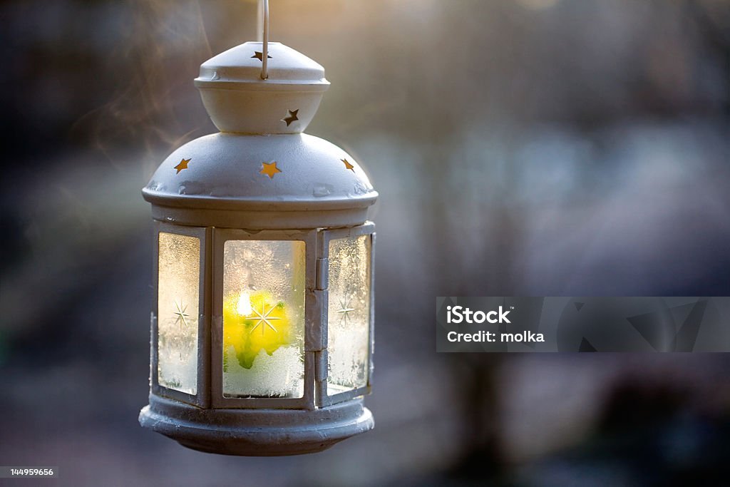 Lantern Decorative white lantern with burning candle inside Autumn Stock Photo