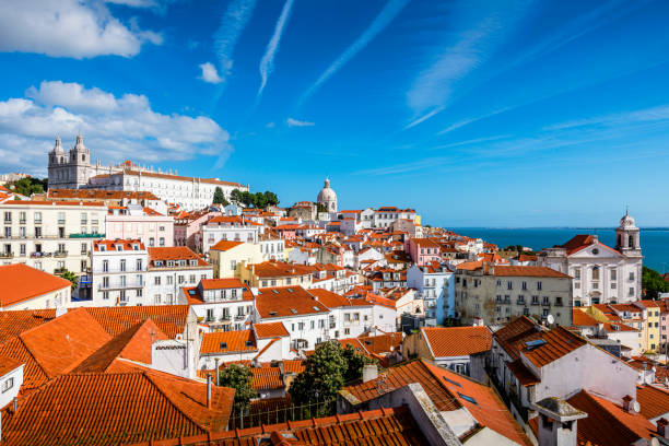 aerial view over the rooftops of Lisbon aerial view over the rooftops of Lisbon. In background is Tagus River lisbon stock pictures, royalty-free photos & images