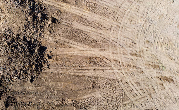 istock Wheel tracks on dirt. tractor tracks, 1449603307