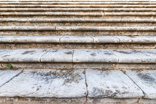 Close-up of old stone steps of the stairs.