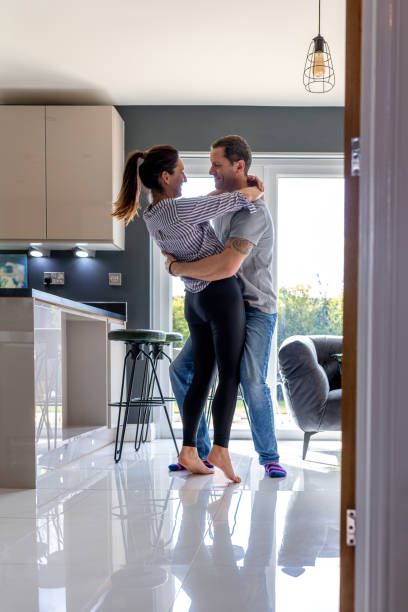 istock Holding My Partner in The Kitchen 1449604876