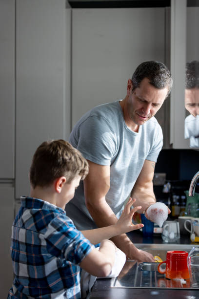 istock Helping With Cleaning The Dishes 1449604971