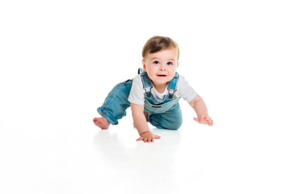 istock Cheerful baby boy toddler on white studio background 1449605323