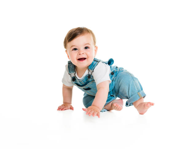 istock Cheerful baby boy toddler on white studio background 1449605327