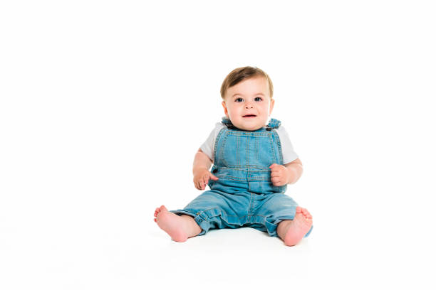 istock Cheerful baby boy toddler on white studio background 1449605330
