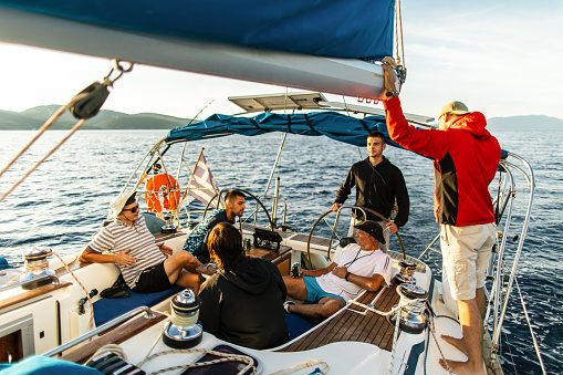 Sailing crew on sailboat on regatta in action. Models and event regatta property released.