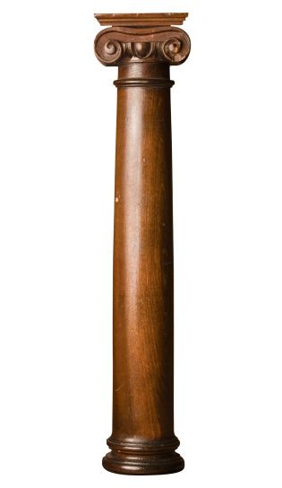 Isolated high contrast Greek Corinthian style column carved out of wood with very dark stain - with clipping path