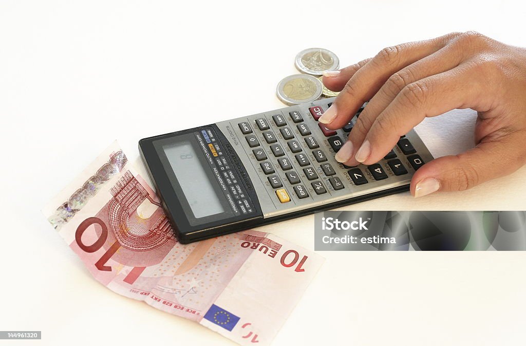 Bills A woman with a calculator and some money (euros) Adult Stock Photo