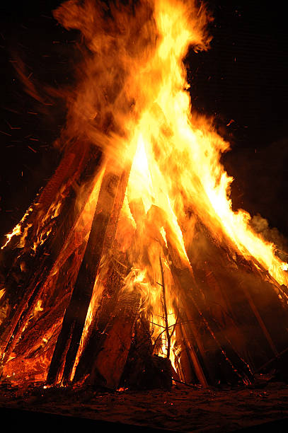 Pyre - Bonfire Huge pyre ignited during the saint-john night (june 24th) st jean saint barthelemy stock pictures, royalty-free photos & images