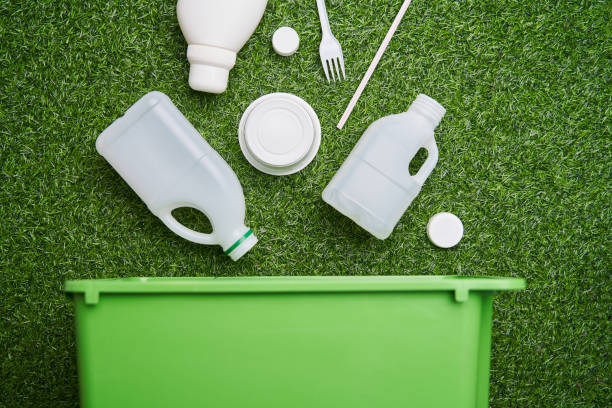 istock Plastic collected for recycling on green grass background. 1449615574
