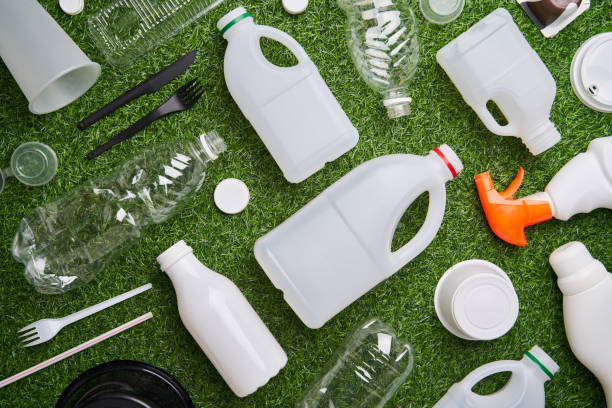 istock Plastic collected for recycling on green grass background. 1449615909