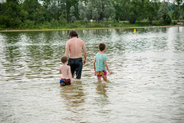 istock walking deeper in the lake 1449616416