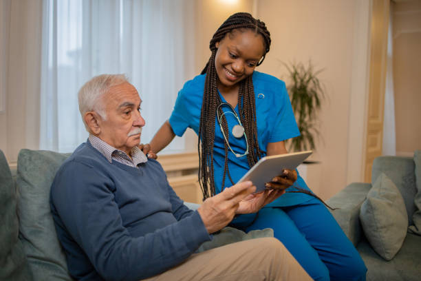 istock Nurse helping senior man 1449617933