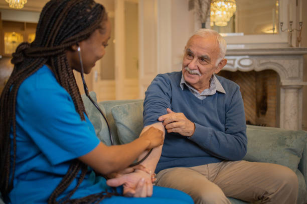 istock Nurse helping senior man 1449617947