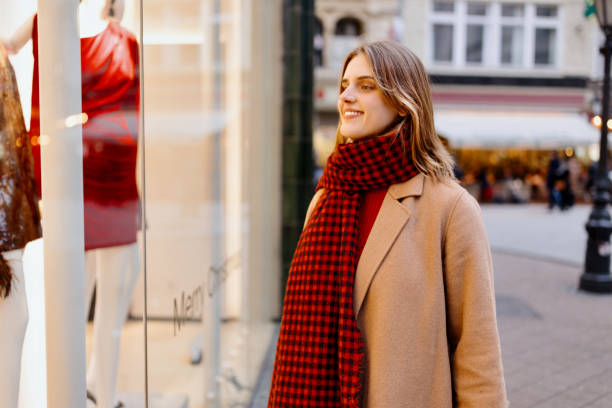 istock Young happy woman doing Christmas shopping 1449618338