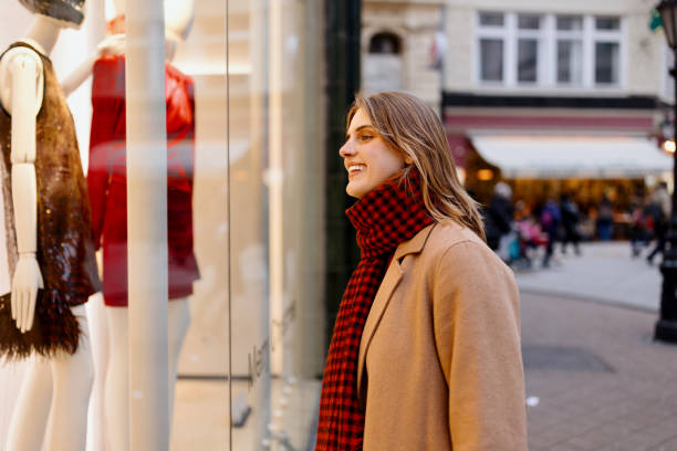 istock Young happy woman doing Christmas shopping 1449618475