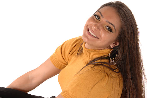 Close up portrait of a beautiful smiling confident young woman in stylish outfit, isolated on white background.