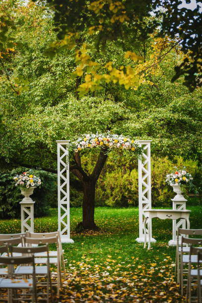 istock Beautiful wedding arch decorated with fresh flowers 1449620052