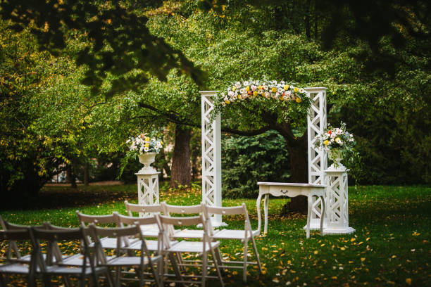 istock Beautiful wedding arch decorated with fresh flowers 1449620102