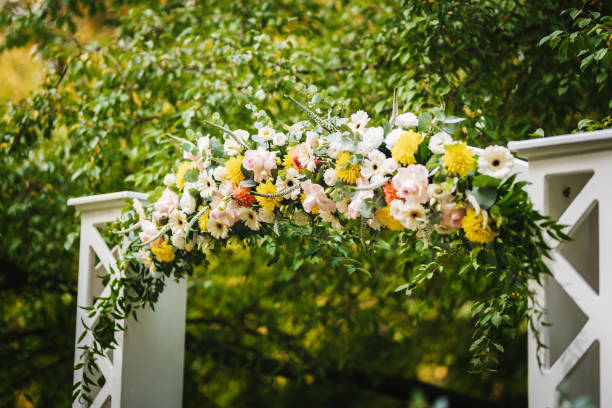 istock Beautiful wedding arch decorated with fresh flowers 1449620118