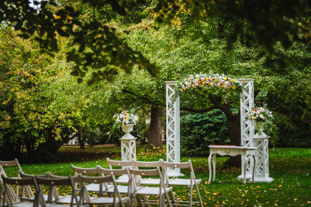 istock Beautiful wedding arch decorated with fresh flowers 1449620164