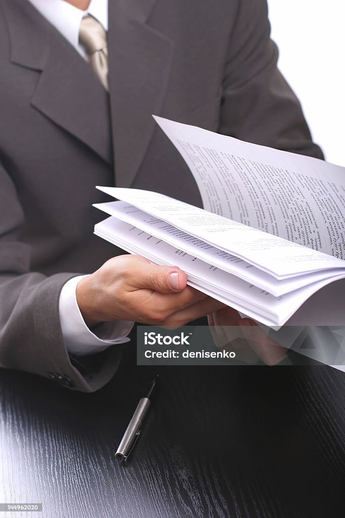 Uomo d'affari con documenti - Foto stock royalty-free di Abbigliamento da lavoro