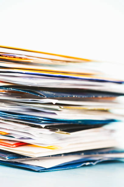 istock Large stack of junk mail or paperwork on a desk 1449621047