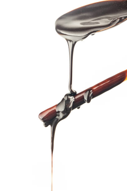 istock The chocolate sauce flows over the biscuit stick 1449623223