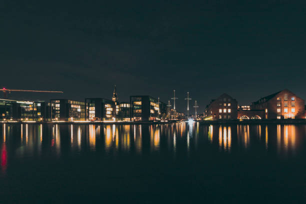 istock buildings by the water at night 1449623390