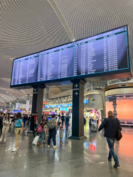 istock blurred background with airport terminal information screen 1449629641