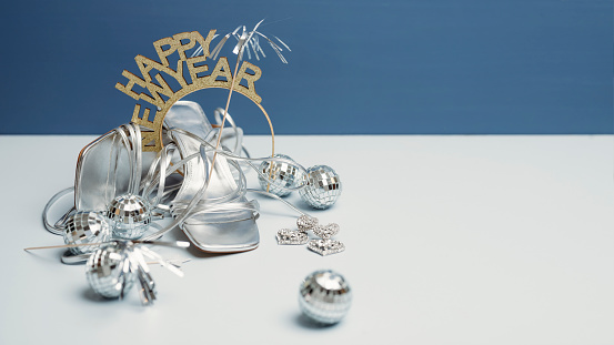New years and glitter still life photo party accessories
Still life studio shot on blue background
