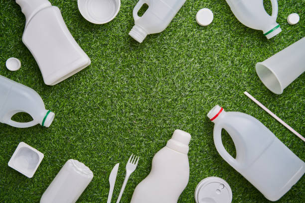 istock Plastic collected for recycling on green grass background. 1449630236