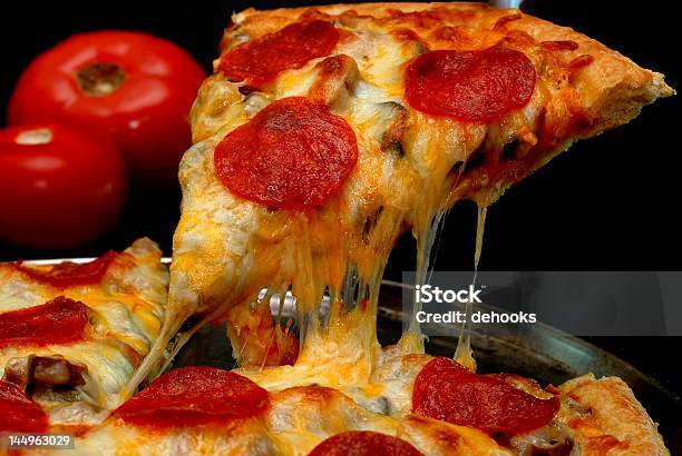 Pepperoni Pizza Slice Stock Photo - Download Image Now - Black Background, Pizza, Slice of Food