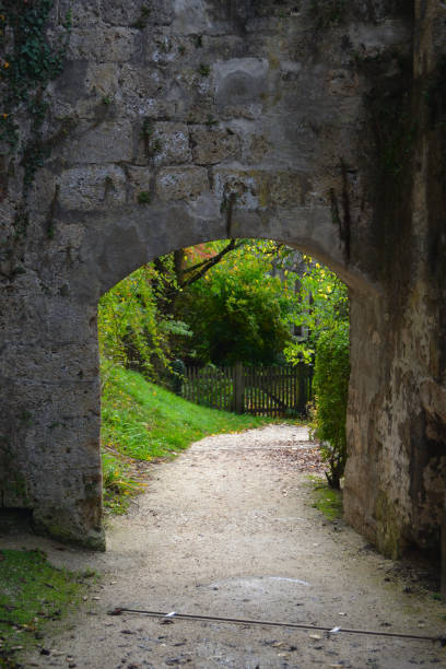 istock the path from a medieval gate into the open green 1449630447