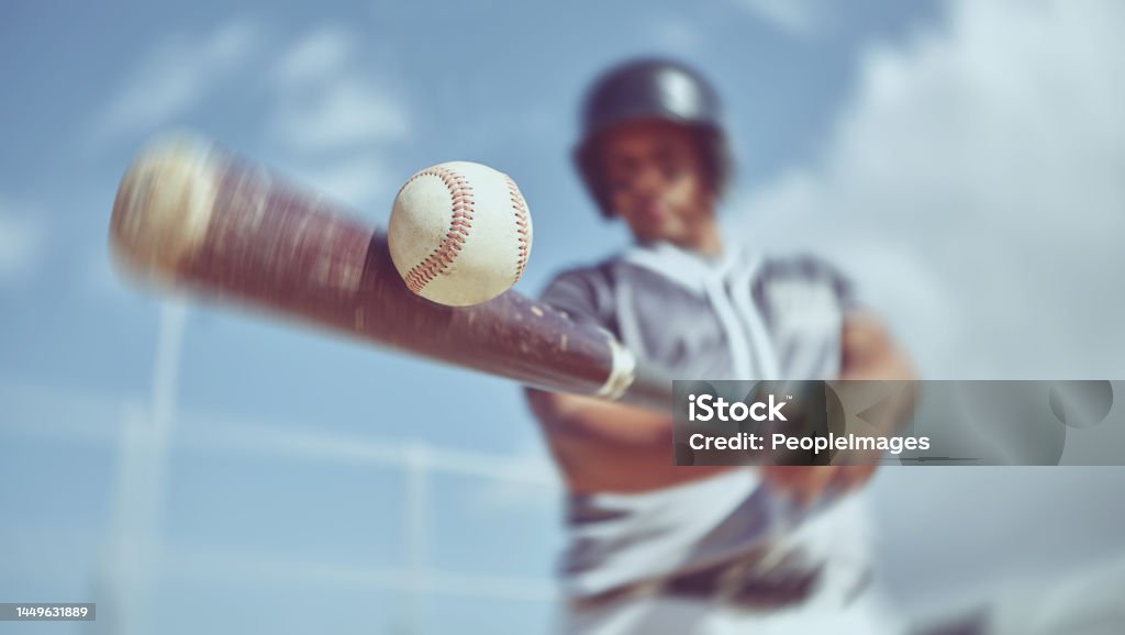 Baseball, baseball player and bat ball swing at a baseball field during training, fitness and game practice. Softball, swinging and power hit with athletic guy focus on speed, performance and pitch Baseball - Ball Stock Photo