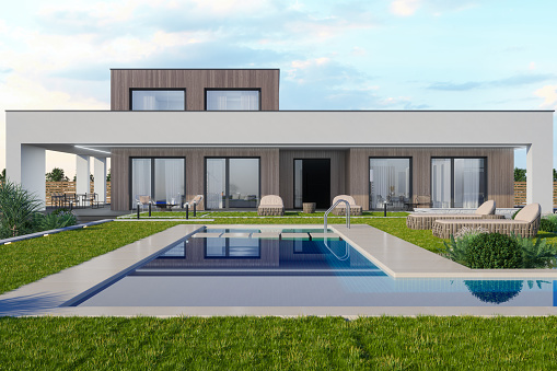 Exterior Of Luxurious Villa With Swimming Pool, Lounge Chairs And Garden