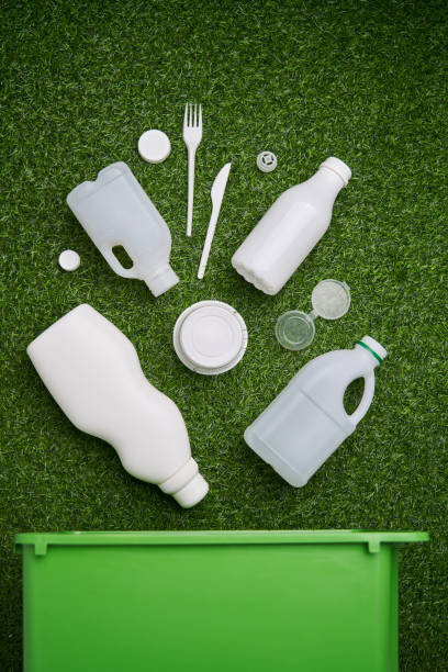 istock Plastic collected for recycling on green grass background. 1449633899