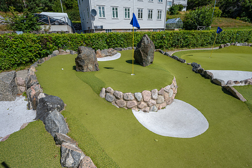Mölndal, Sweden - July 17 2022: Compact minigolf course at summer.