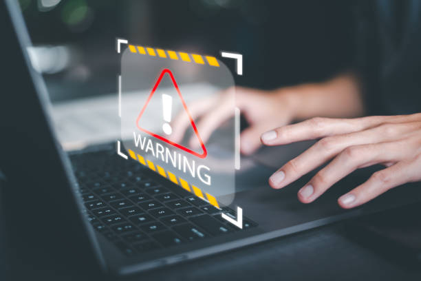 istock Businessman using a laptop to work,alert and foreign body detection,spyware virus,internet network security concept,cyber security auditing system,Alerts to watch out for danger 1449637035