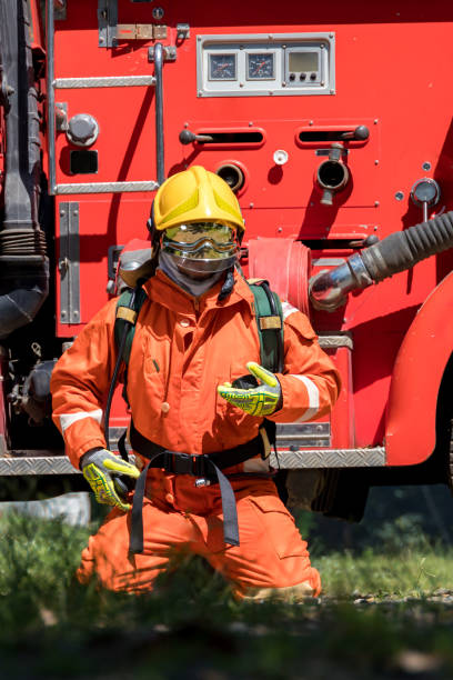 istock Fireman with equipment in a fully protective suit 1449637069