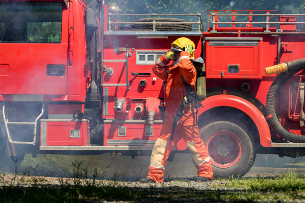 istock Fireman with equipment in a fully protective suit 1449637070