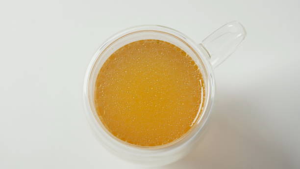 istock Chicken bone broth in transparent glass cup 1449639537