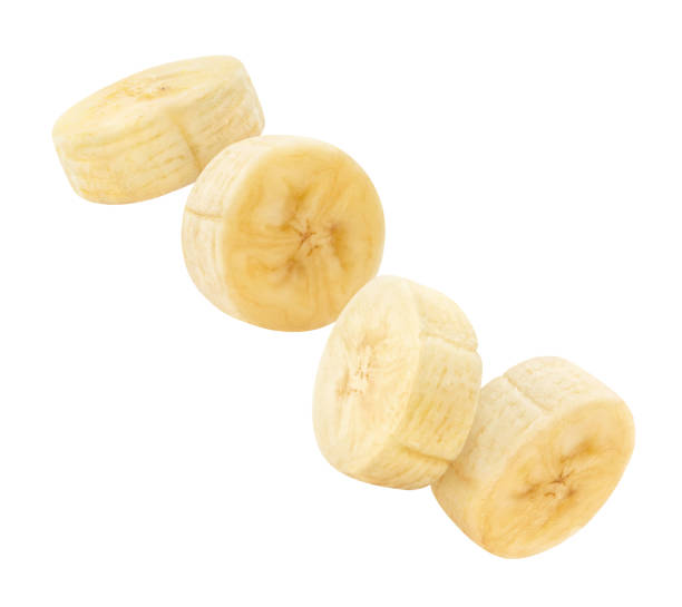 istock Flying banana slices on white 1449639951