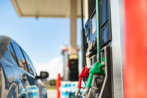 Western USA Economy and Inflation Filling Gas Tank Viewing Sales Price at The Pump Photo Series