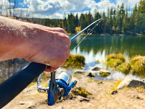 Grand Mesa National Forest Outdoor Environment Male Fisherman in Rocky Mountains Spin Cast Fishing Photo Series