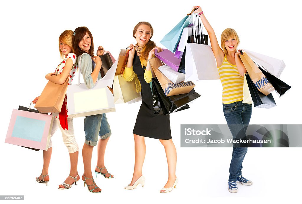 Quatro mulheres jovens Carregando sacolas de compras - Foto de stock de Amizade royalty-free