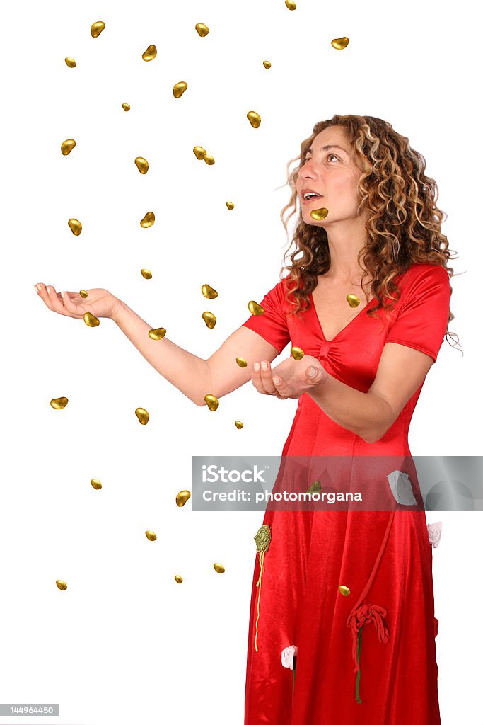 Raining Gold Beautiful woman holding her hands up for raining gold - like the fairytale ""The Star-Money"". Adult Stock Photo