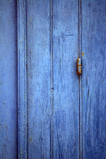 PurpleBlue Purple Blue wooden window ahutter with a rusty hinge in Skopelos, Greece. alintal stock pictures, royalty-free photos & images