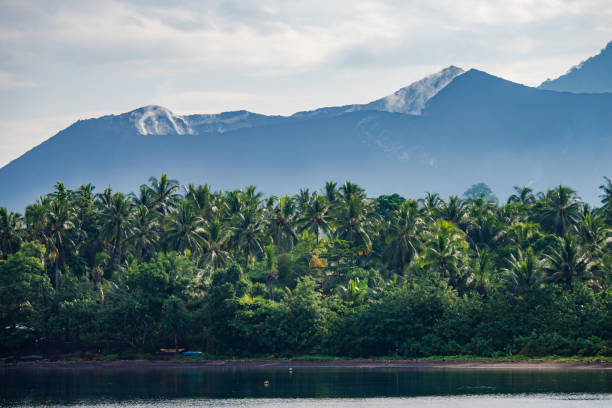 Clouds above volcano in Papua New Guinea Clouds form above volcanos in the Pacific Ocean above remote tropical islands in Papua New Guinea new britain island stock pictures, royalty-free photos & images
