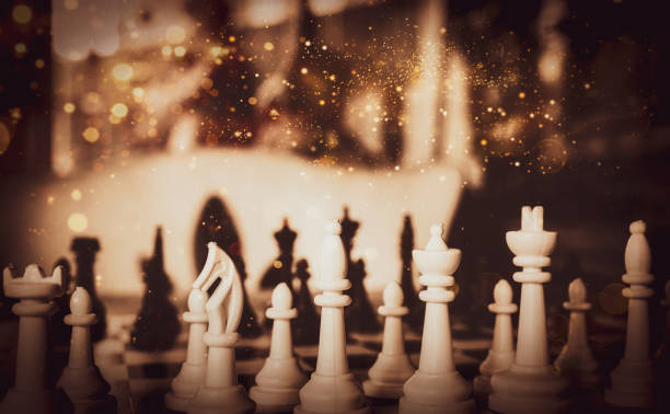 istock Chessboard and chess pieces on a wooden table with soft and retro colors 1449648342